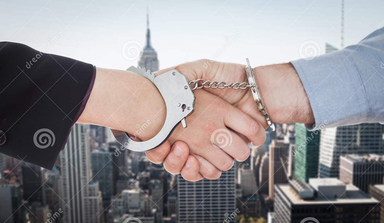 http://www.dreamstime.com/stock-photos-composite-image-business-people-handcuffs-shaking-hands-against-new-york-image52718933